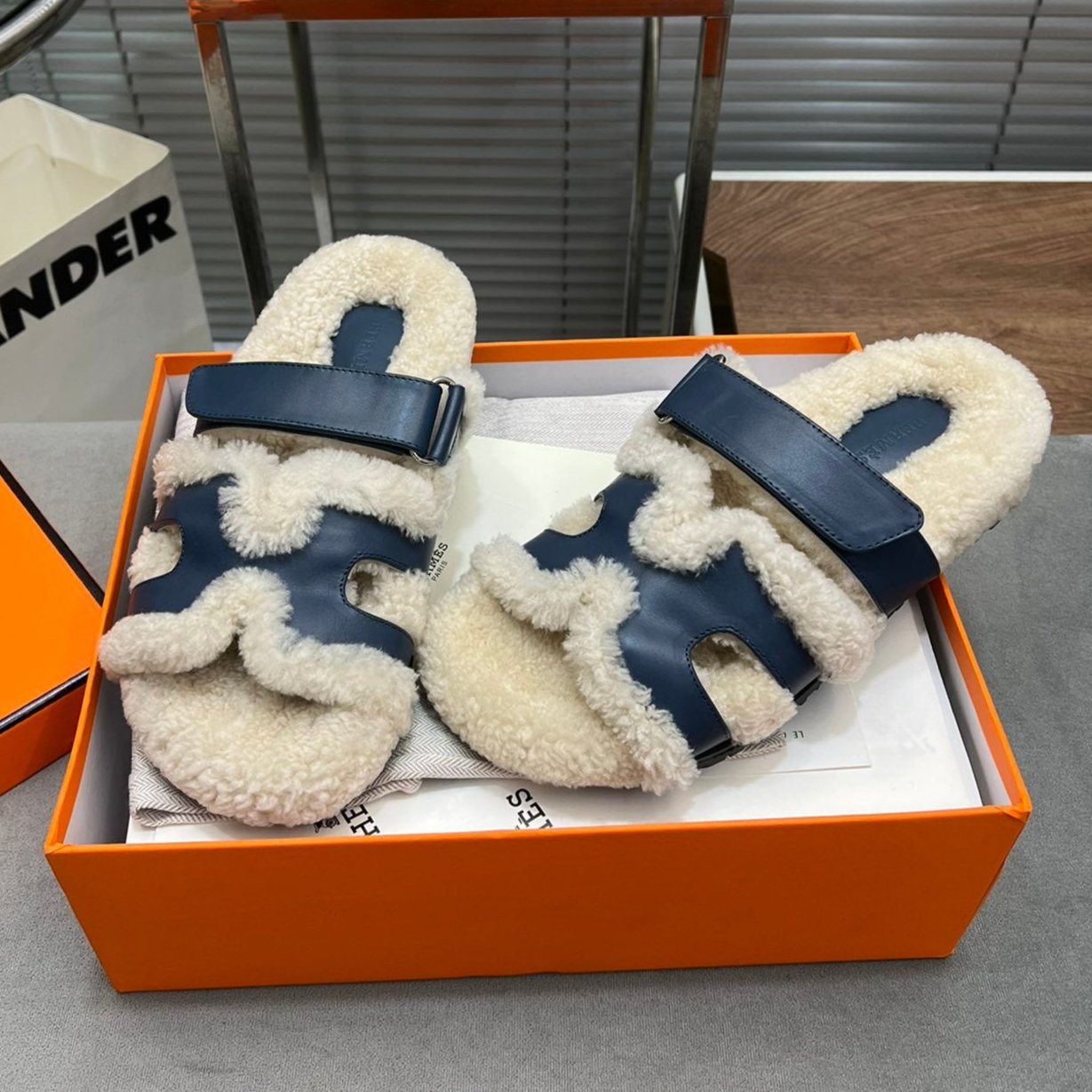 HERMES CHYPRE SLIPPERS IN BEIGE LAMB WOOL AND CLASSIC BLUE CALFSKIN